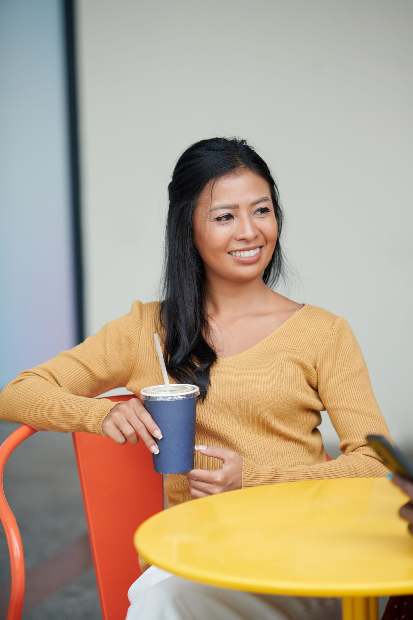 elegant-woman-at-coffeeshop-table-2025-01-31-06-35-41-utc