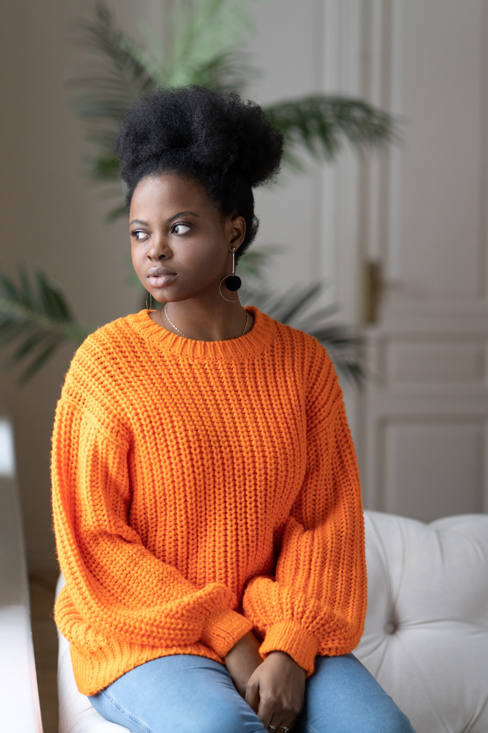 pensive-african-millennial-woman-wear-orange-sweat-2025-03-08-21-49-36-utc