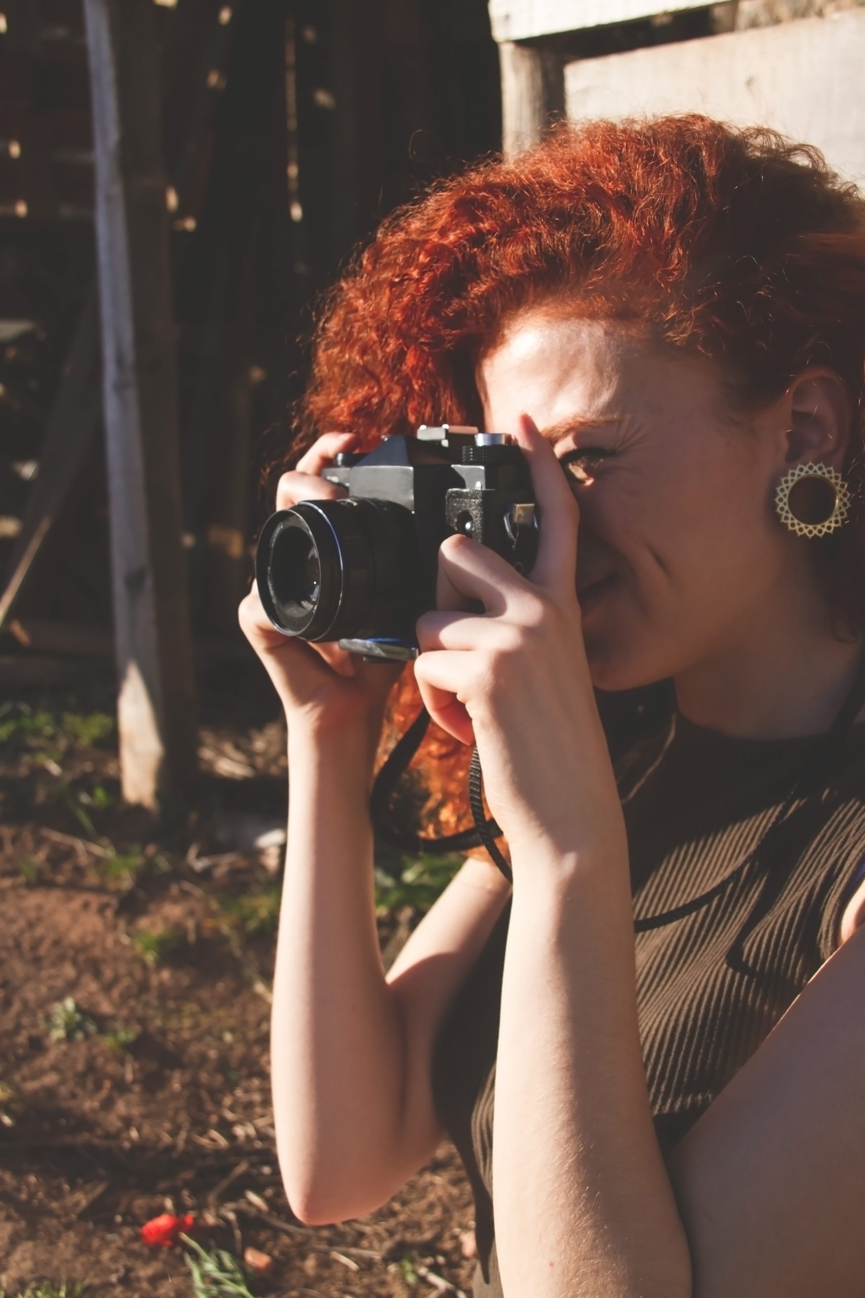 young-redhead-photographer-woman-enjoying-her-pass-2024-10-18-04-06-31-utc
